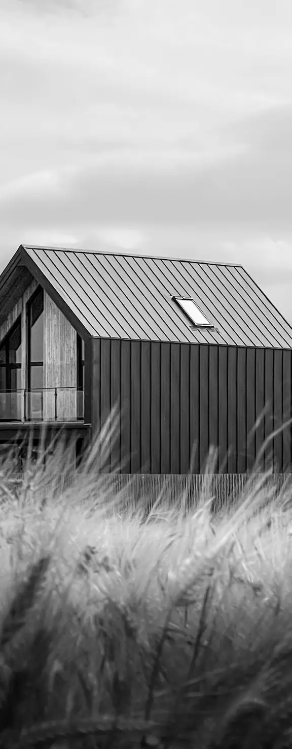 Standing-seam metal roof on a farmhouse