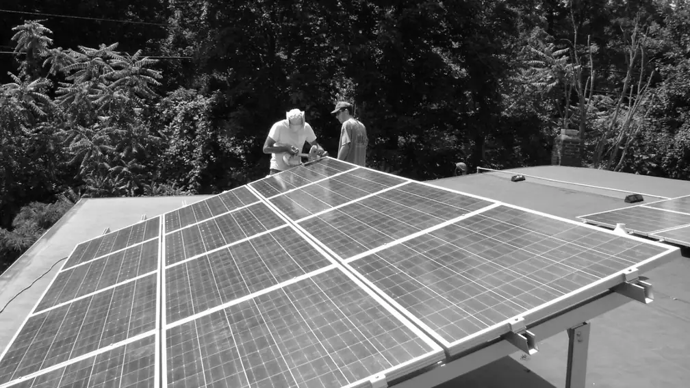 Installers working on a roof